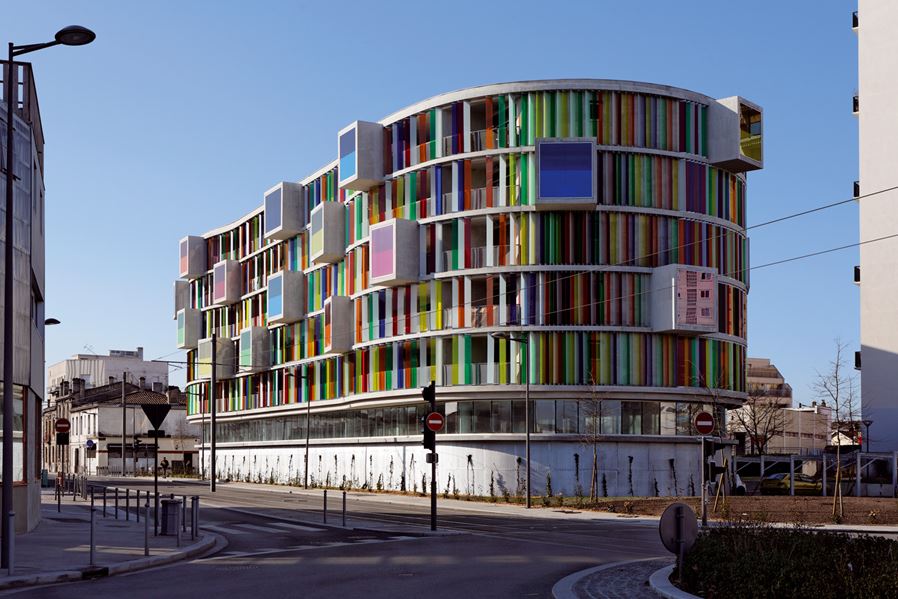Colorful facade Arc en Ciel building designed by Barnard Buhler Architects