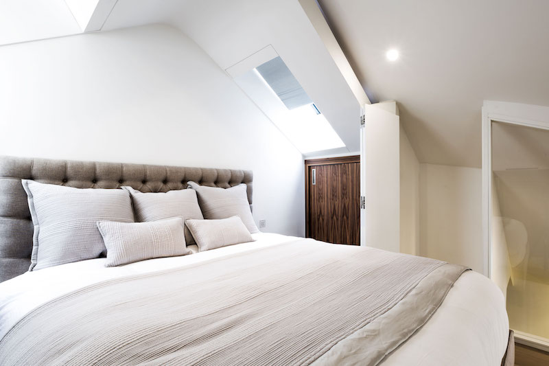 Penthouse apartment in church master bedroom skylight