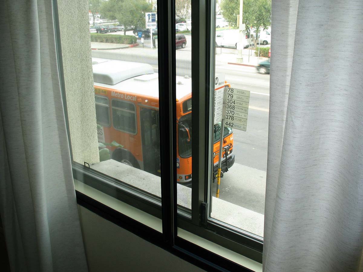 The bus stops right outside the window in this unit.